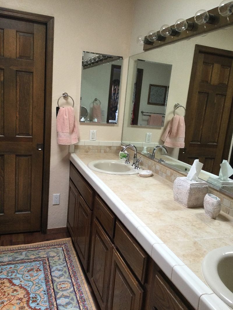 The walk-in closet is through the master bathroom.