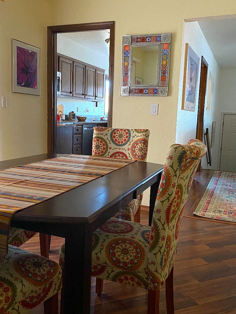 The dining room has an entrance to the kitchen, the living room, and the patio.
