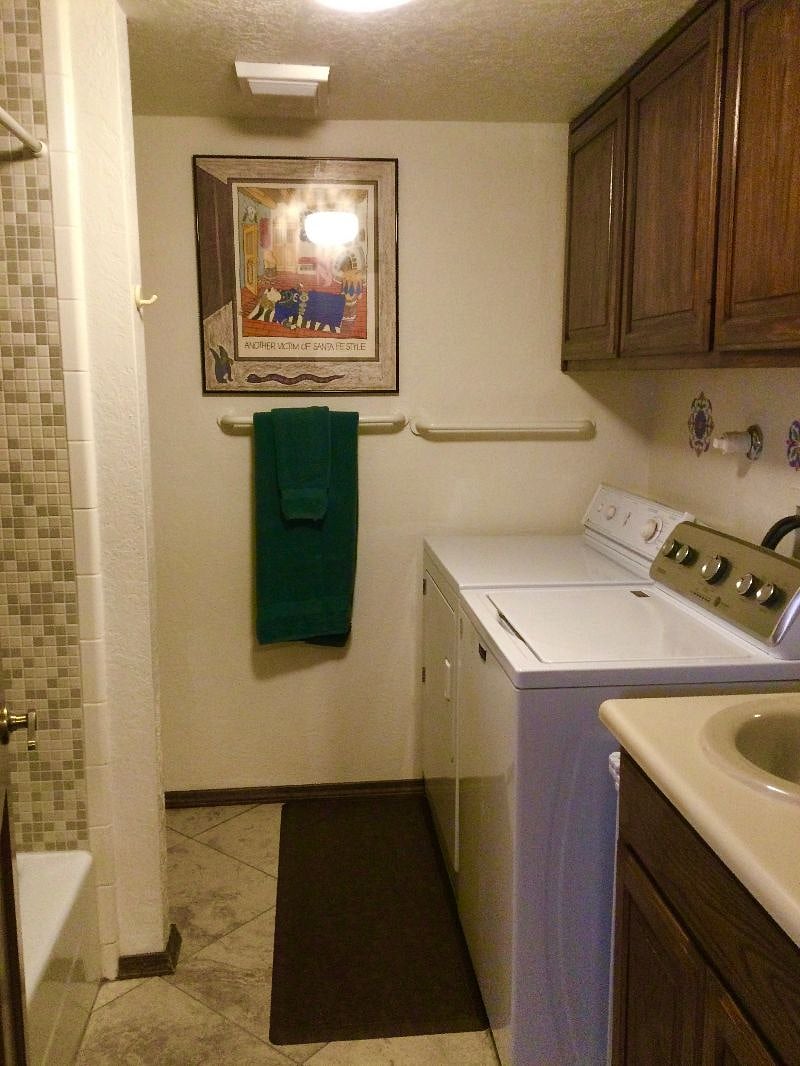 The laundry room and third full bathroom