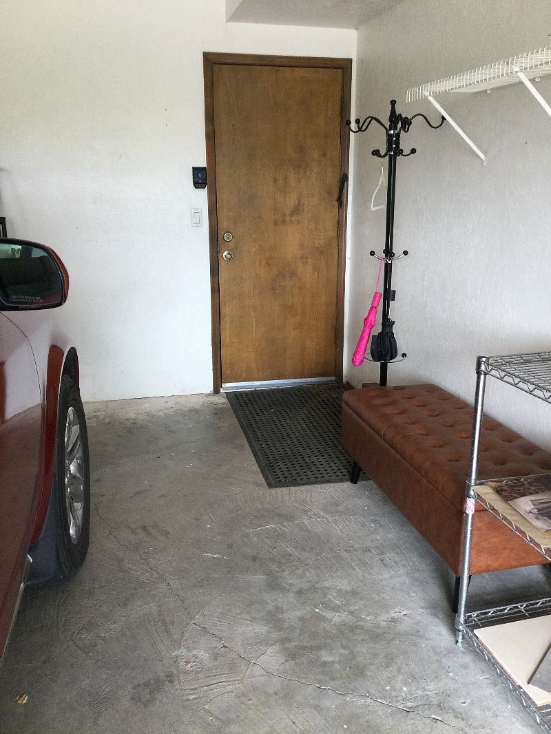 The garage has a bench and rack for your wet clothes or umbrellas...a make shift mud room.
