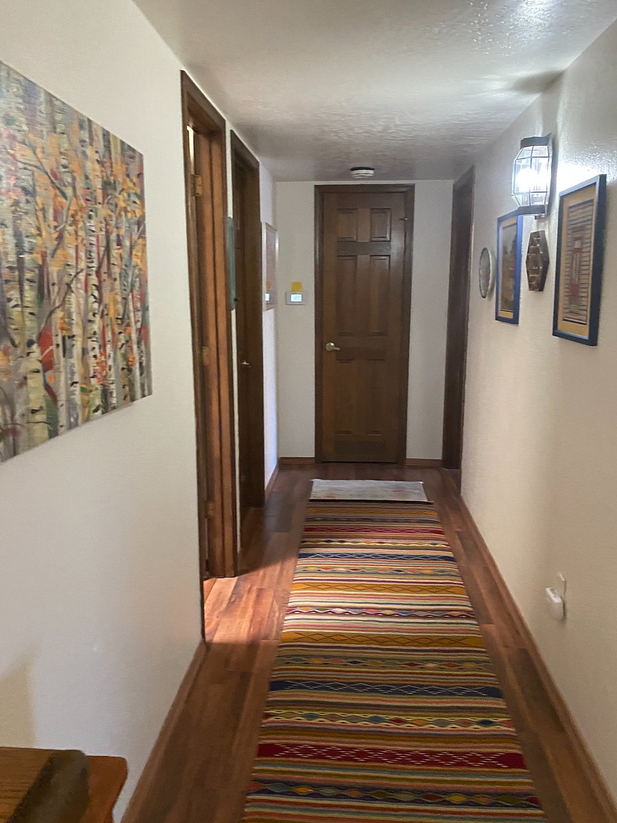This hallway will take you to the master or guest bedroom, and the hall bath.