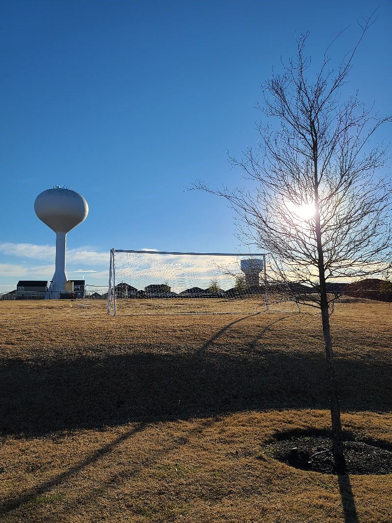 Community area walking trail and soccer field