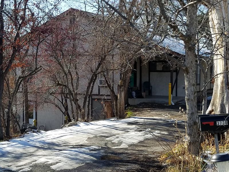 East side, top of path, with gravel driveway.