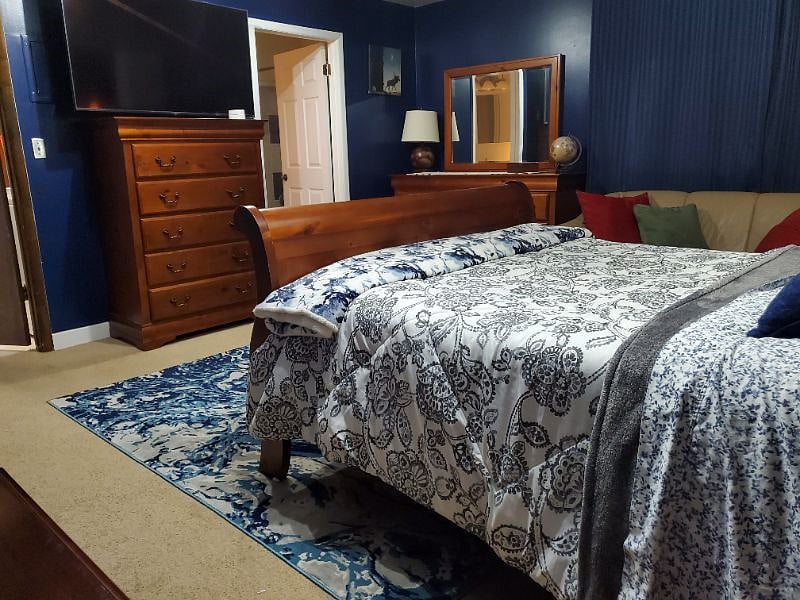 The blue paint and blackout curtains keep it dark in here, perfect for day sleepers.
