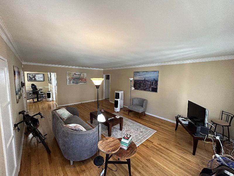 Alternate view of the living room, taken from the corner of the living room by the AC Unit.