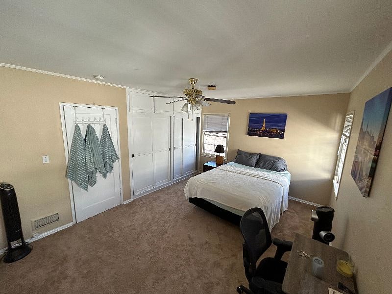 Master bedroom, from the corner of bedroom by the new AC window unit. New carpeting and new paint as of Summer 2023.
