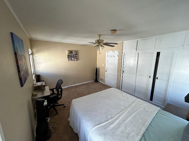 Master bedroom, taken from far corner of bedroom with nice vantage point of the massive closet space available. New AC window unit, new carpeting, new paint job...all new in Summer 2023.