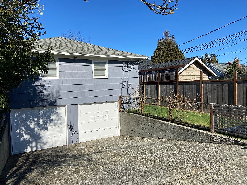 Garage (right side), and available parking in the driveway