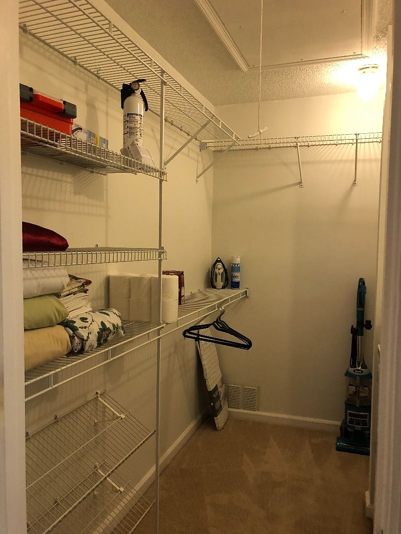 Spacious closet in primary bedroom has shelving