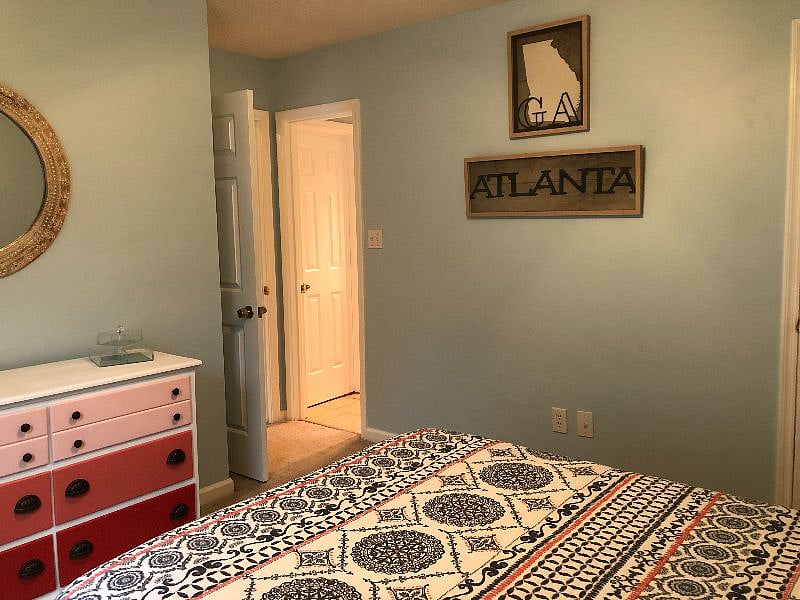Front bedroom with Queen-sized bed and dresser with six drawers