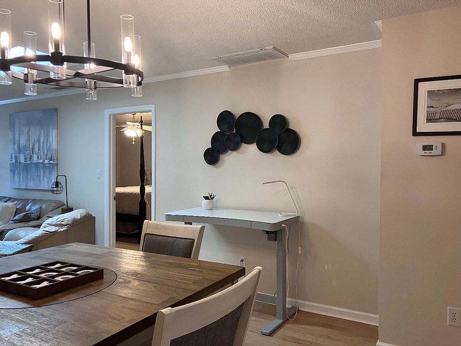 High-top dining table with five chairs and adjustable work table