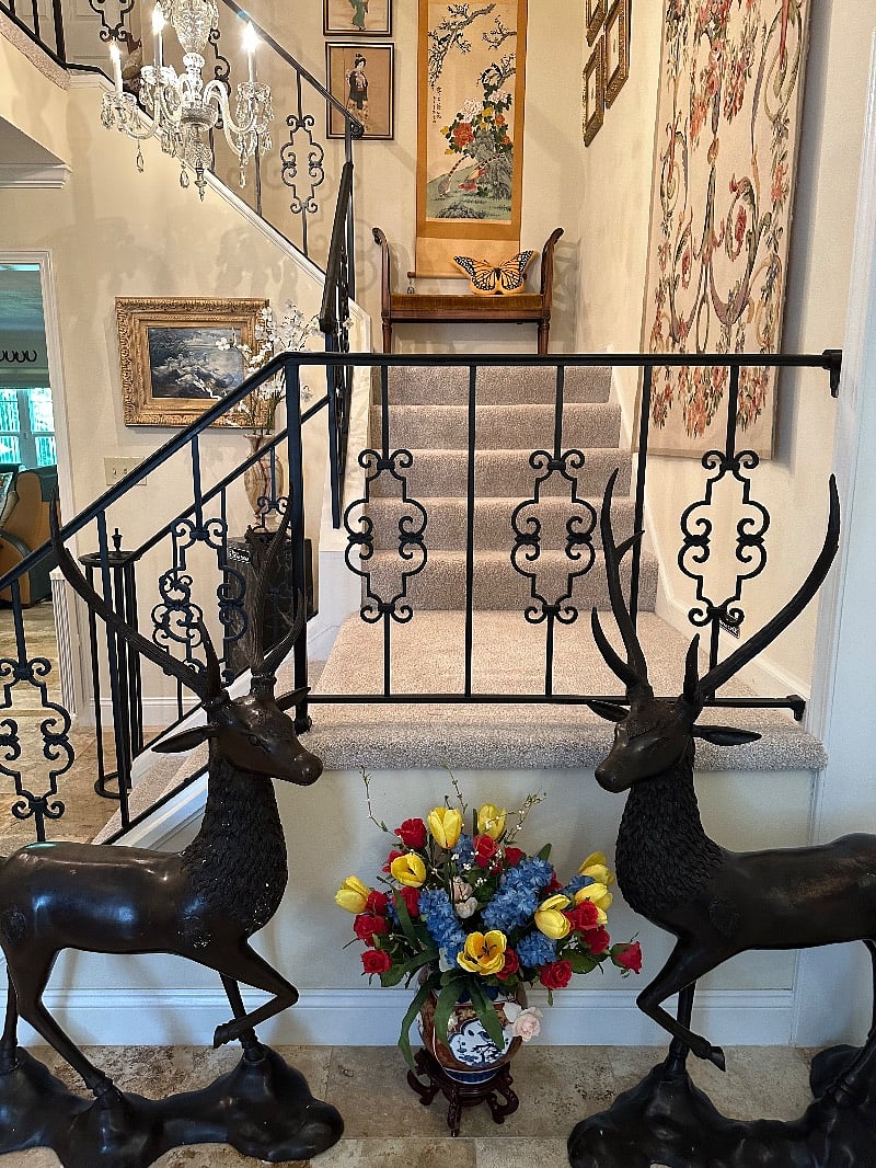 A pair of Bronze deer to welcome you home in the two-story foyer. 