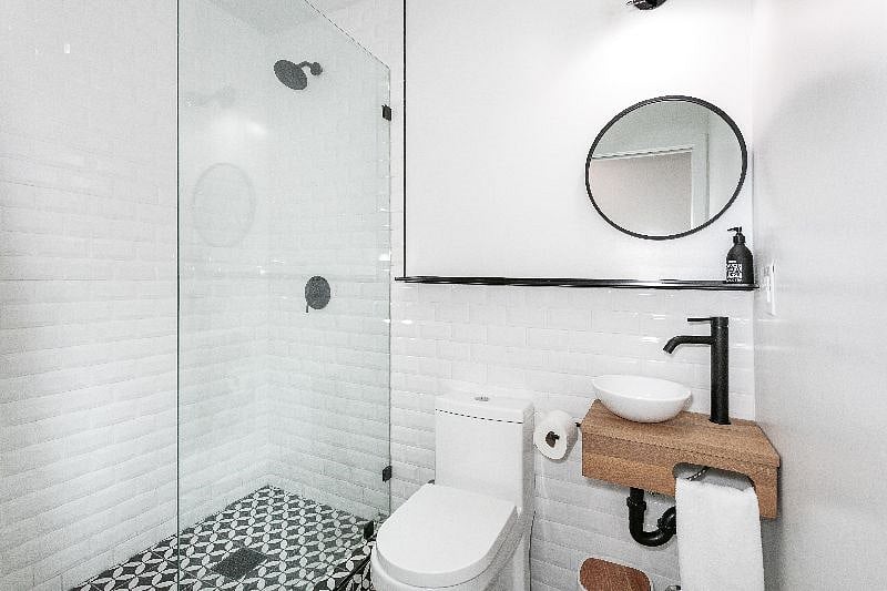 Almost immediately once you've walked into the studio, you'll find the bathroom with a full size shower and elegant fixtures. Towels are provided.