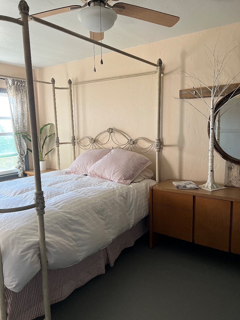 bedroom with queen bed (two windows with view of city lights)