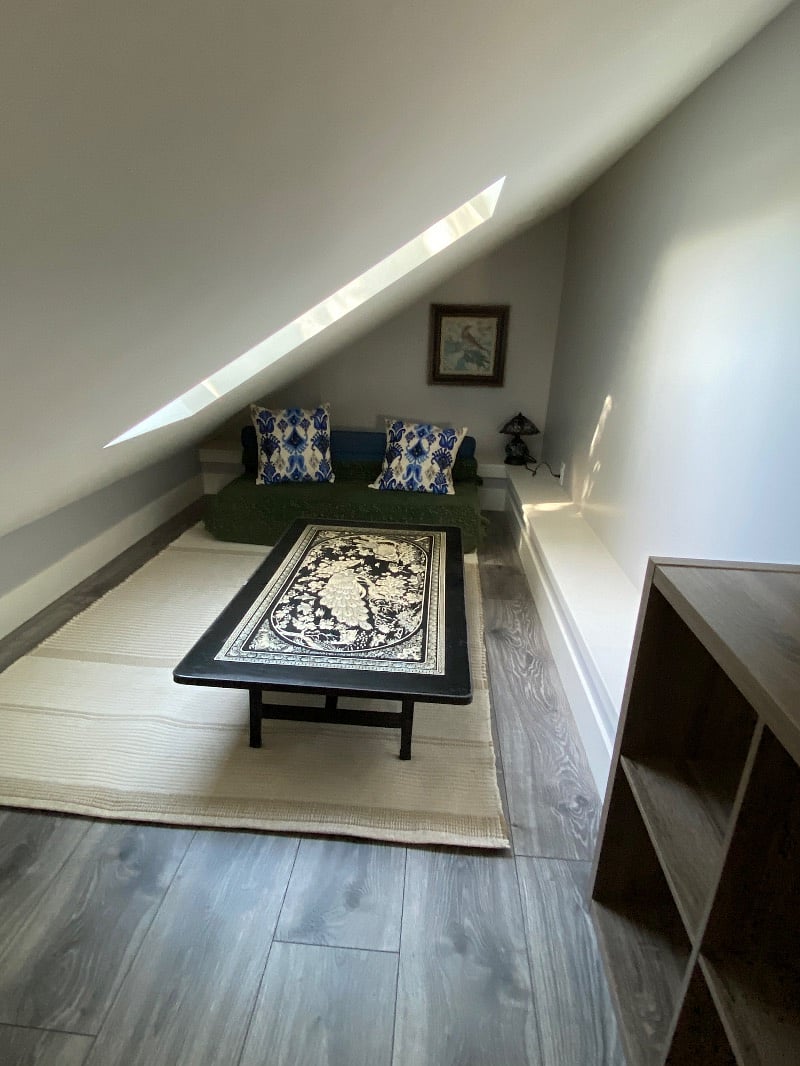 Loft - side area. Great additional space for a home office, relaxing, or sleeping. Couch folds out into a full size futon. Extra bedding provided.