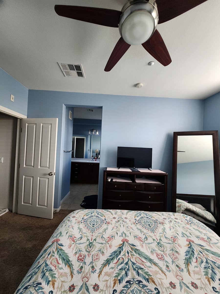 primary bedroom. the hallway to the other bedroom is to the left