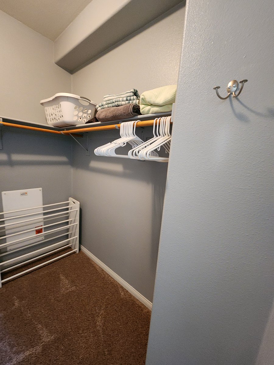 spacious walk-in closet. Sinks/ vanity to the right and toilet room to the left
