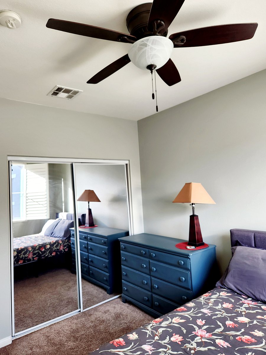2nd bedroom upstairs: a comfy room with windows and blinds