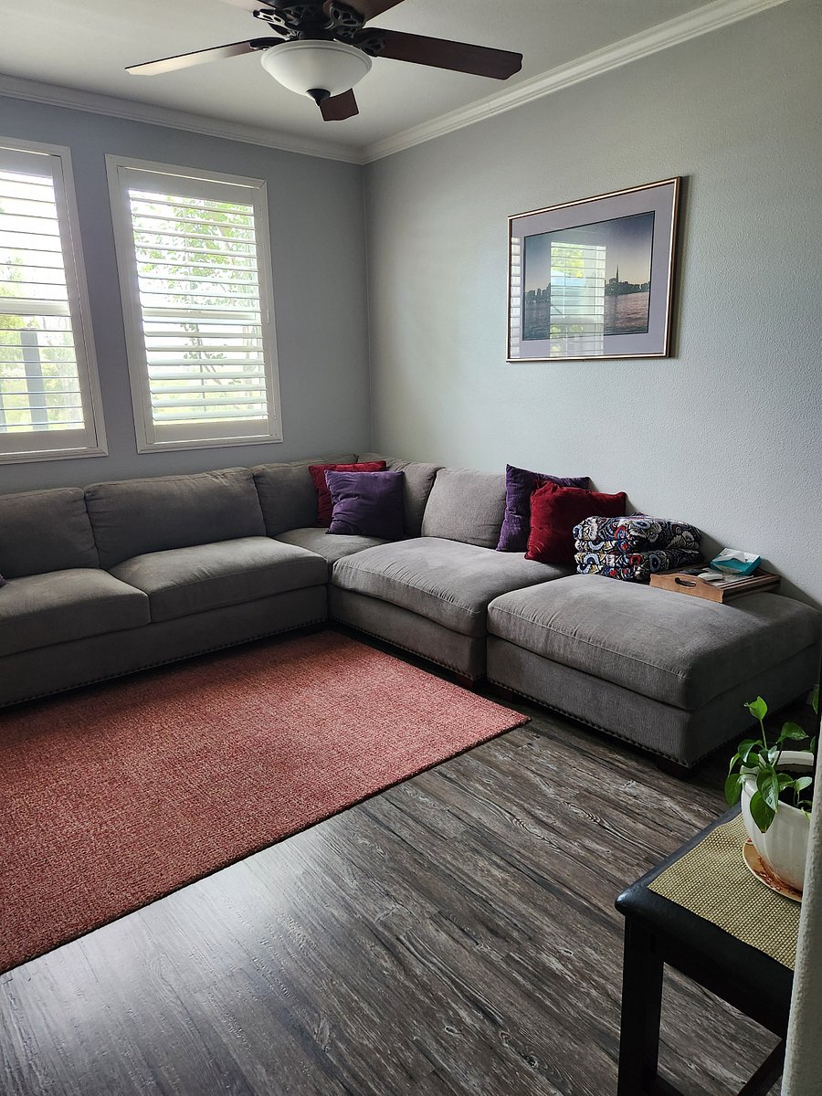 Comfy modular couch facing 90" smart tv