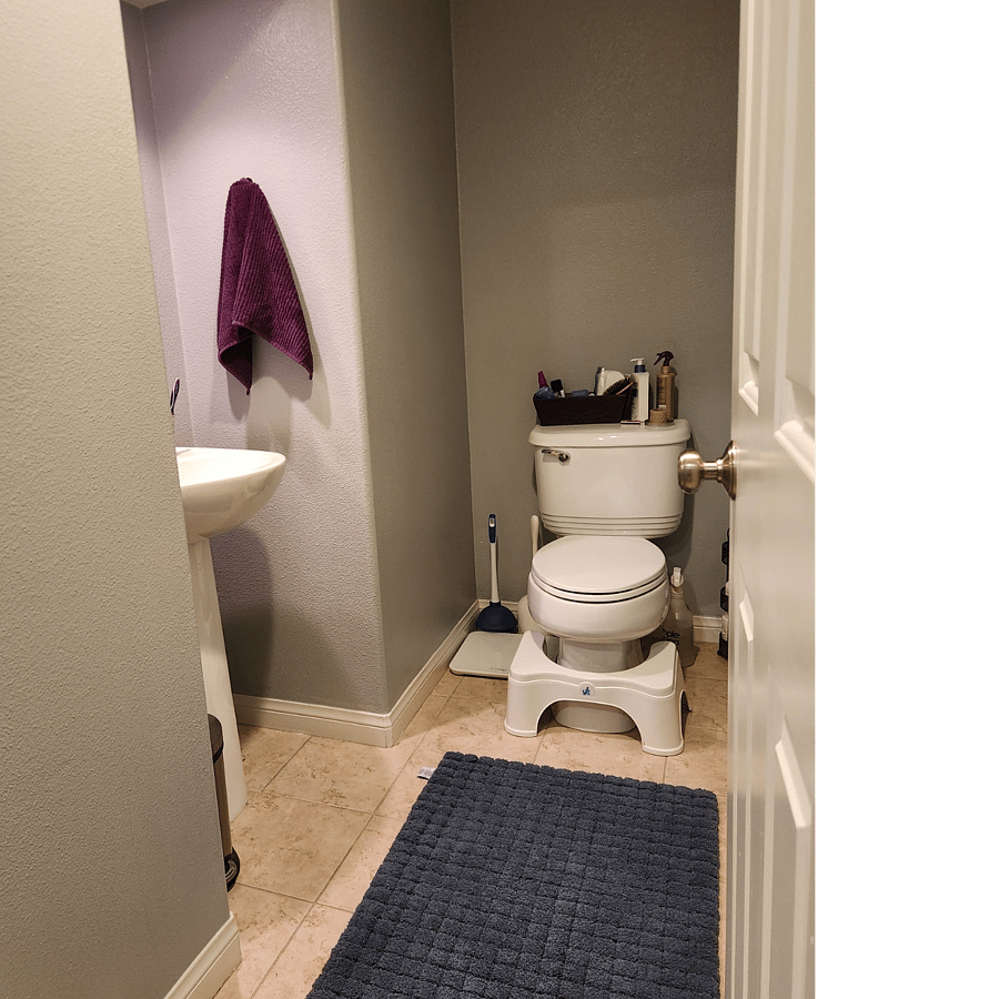 Half bath downstairs, to the right when you walk in the condo from the garage
