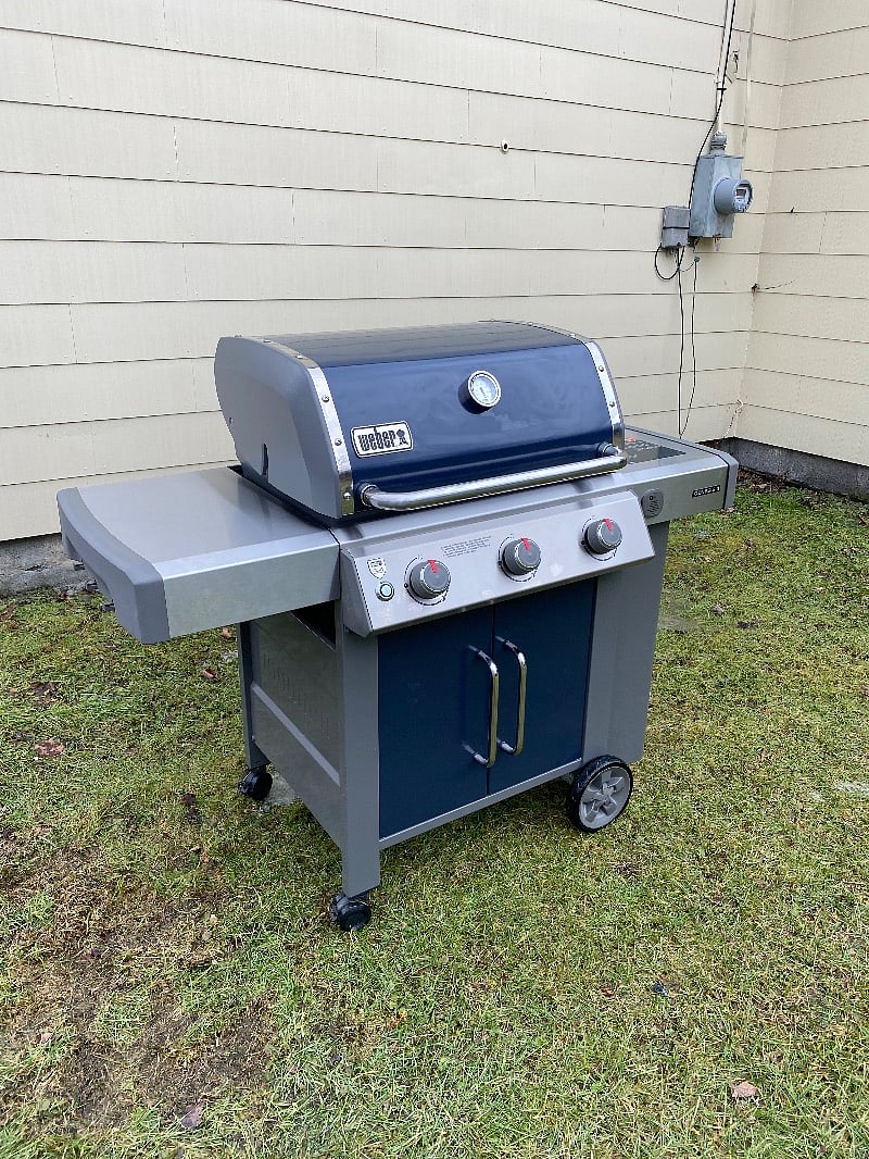 Brand new Weber Grill ready to use in yard.