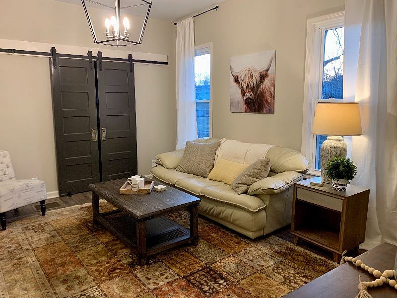Main gathering area. Barn doors lead to the kitchen