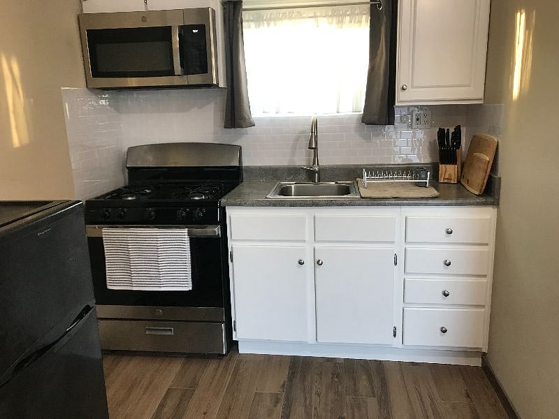 Full sized kitchen with gas stove/oven. The sink is equipped with a garbage disposal, as well.