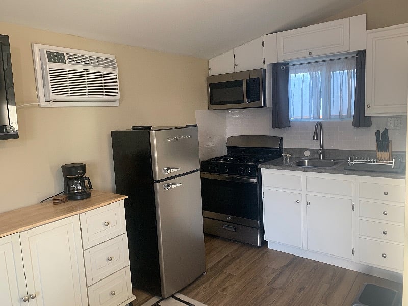 Picture of the kitchen with the new refrigerator