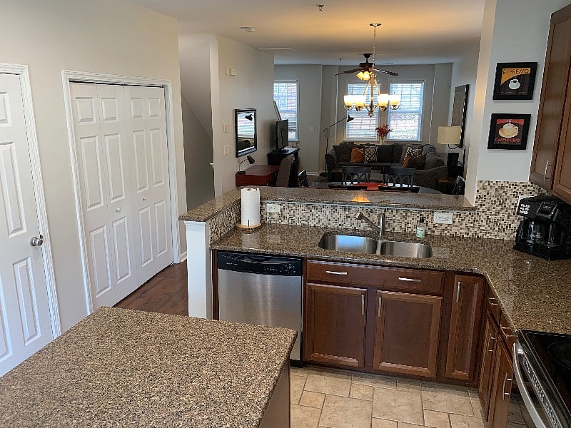 Reverse view.  There is a door to immediate left that is a 1/2 bath off of the kitchen.  The first door on left in this picture is the pantry (with fire extinguisher), the bifold doors next is the laundry area.
