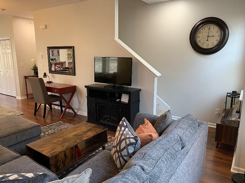 TV Stand is also an electric fireplace that puts out heat and a cozy glow