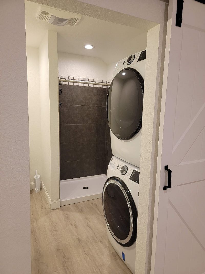 Bathroom with full size stackable washer & dryer