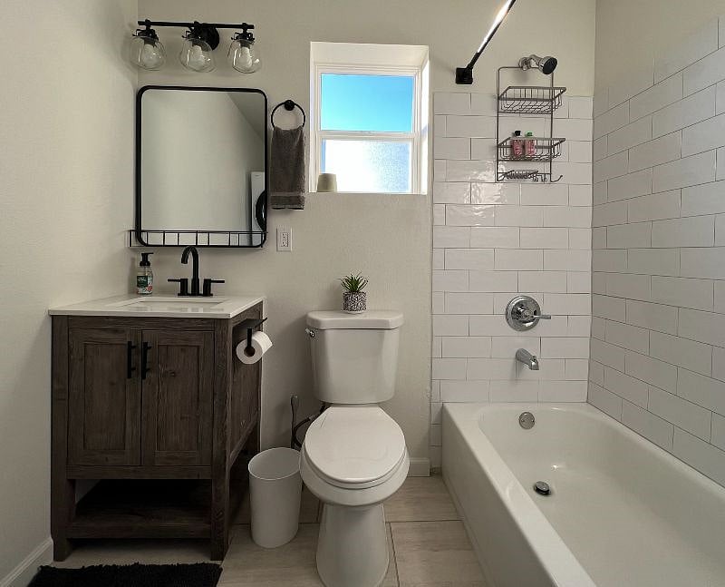Gorgeous Bathroom with Great Natural Light, new Tile tub surround. Take a well deserved soak in the bathtub!  Plenty of Bathroom Storage for your belongings, extra sheets and towels. 