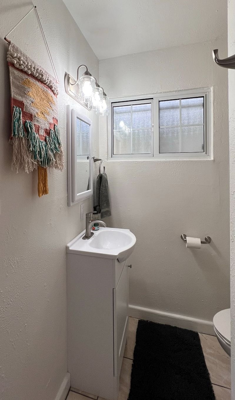 BATHROOM with great Natural Light and a bathtub for a well deserved relaxing soak!