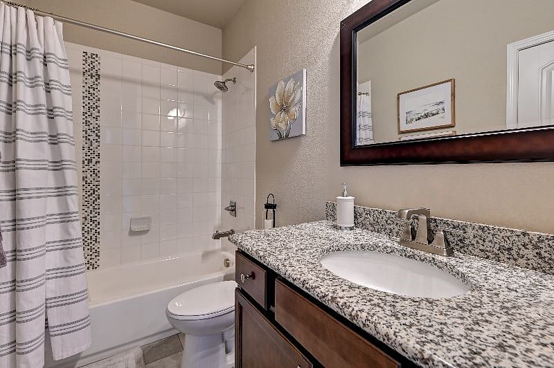 decorative tile shower in 2nd full bathroom