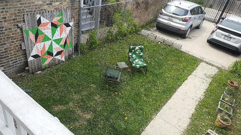 Cute back yard with gas grill
