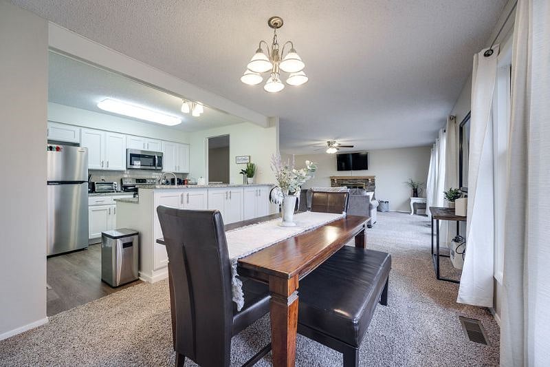 Dining area that comfortably sits 6 and opens up to the living room. Enjoy meals and game nights right here, or set up your work station.