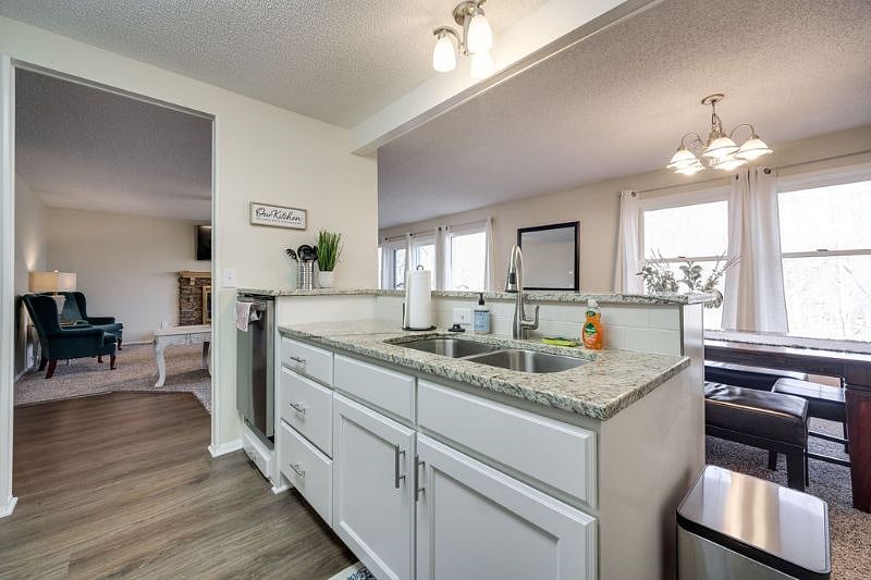 Open layout! This is looking out into the living and dining area. Plus, great views of the tree line!