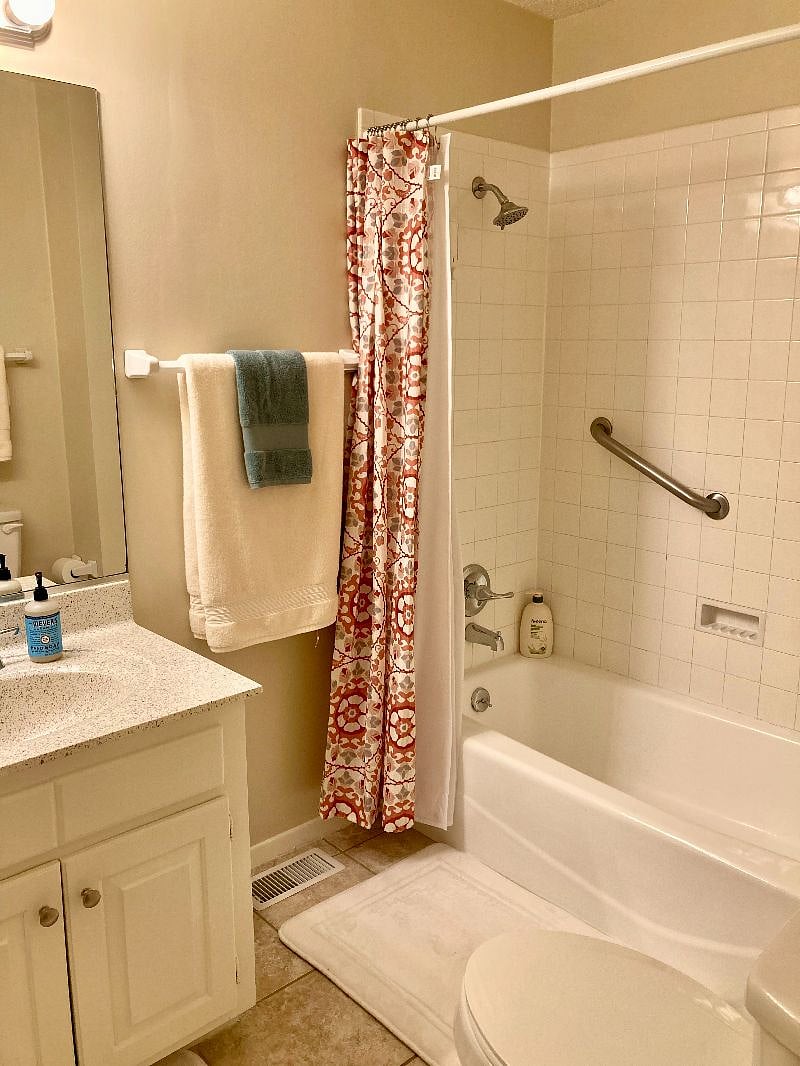 Upstairs en suite, full bathroom. There is access from the bedroom and hallway for convenience. 