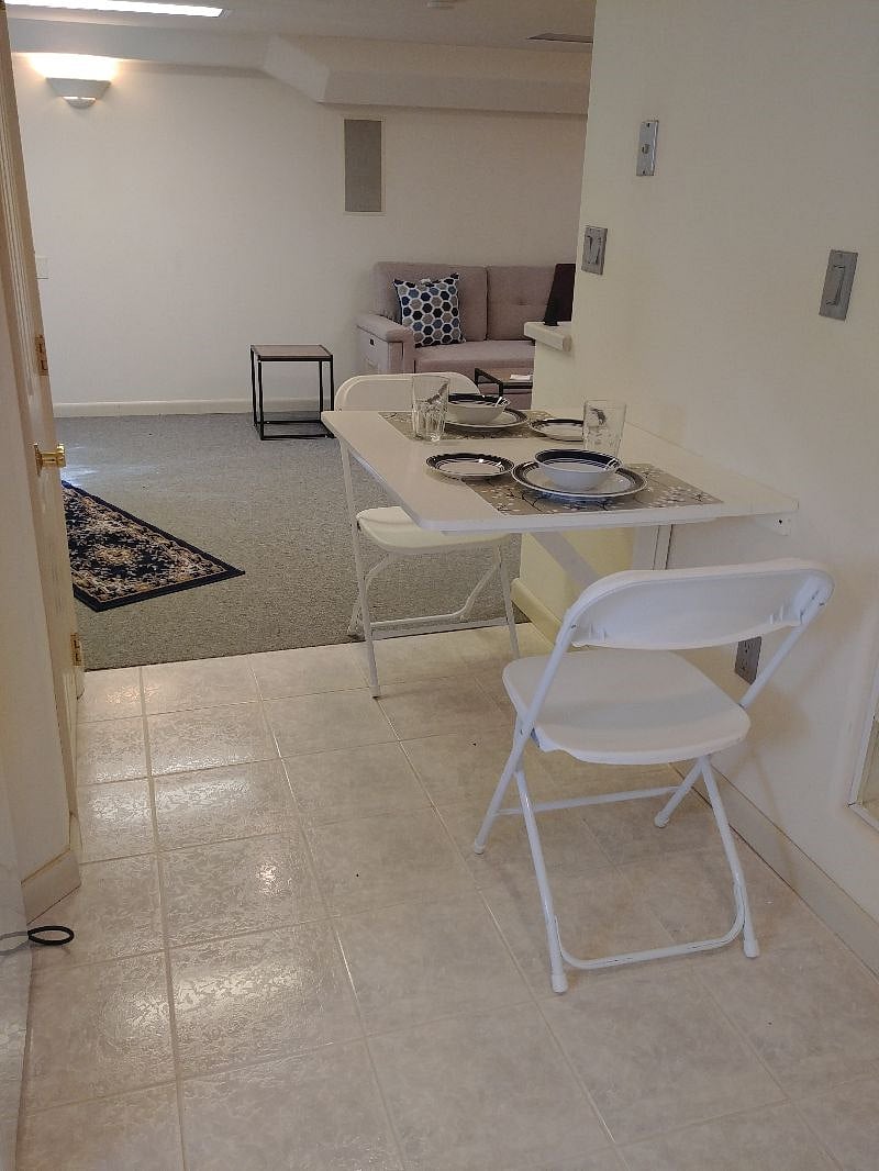 Kitchenette seating. It can be folded up to create extra space if wanted. View toward the living room.