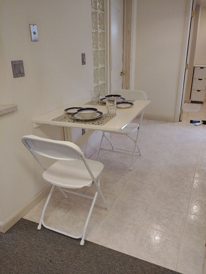 Kitchenette seating. It can be folded up to create extra space if wanted. View toward the bed room.