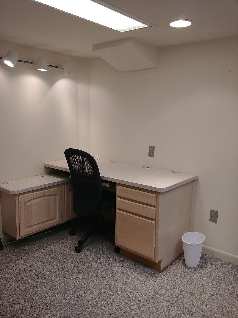 Desk in the bedroom next to the bed.