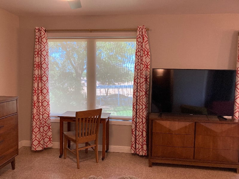 New blackout curtains installed along with solar shades to allow for a view while blocking the sun.