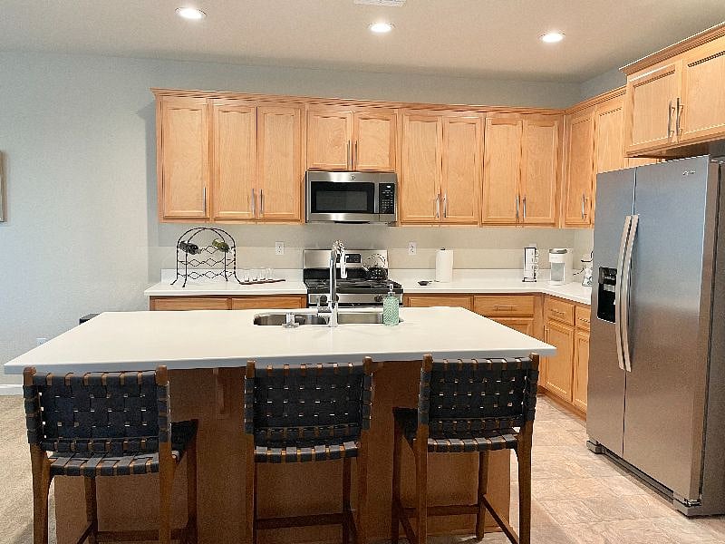 Kitchen comes with a gas range, dishwasher, microwave, and refrigerator.