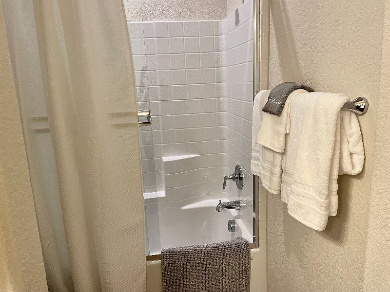 Bathroom 2 comes with a tub and sliding glass door enclosure.