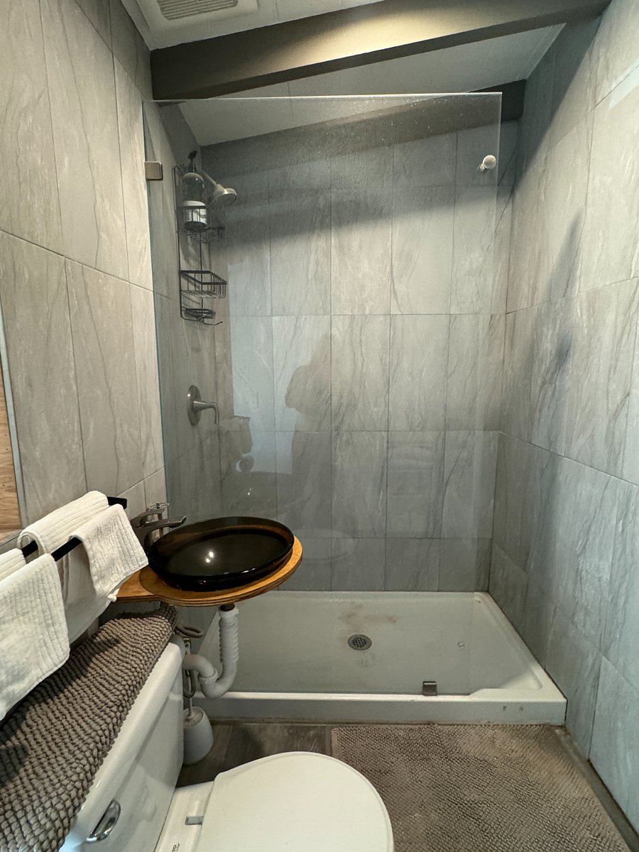 stone  tile and glass shower

