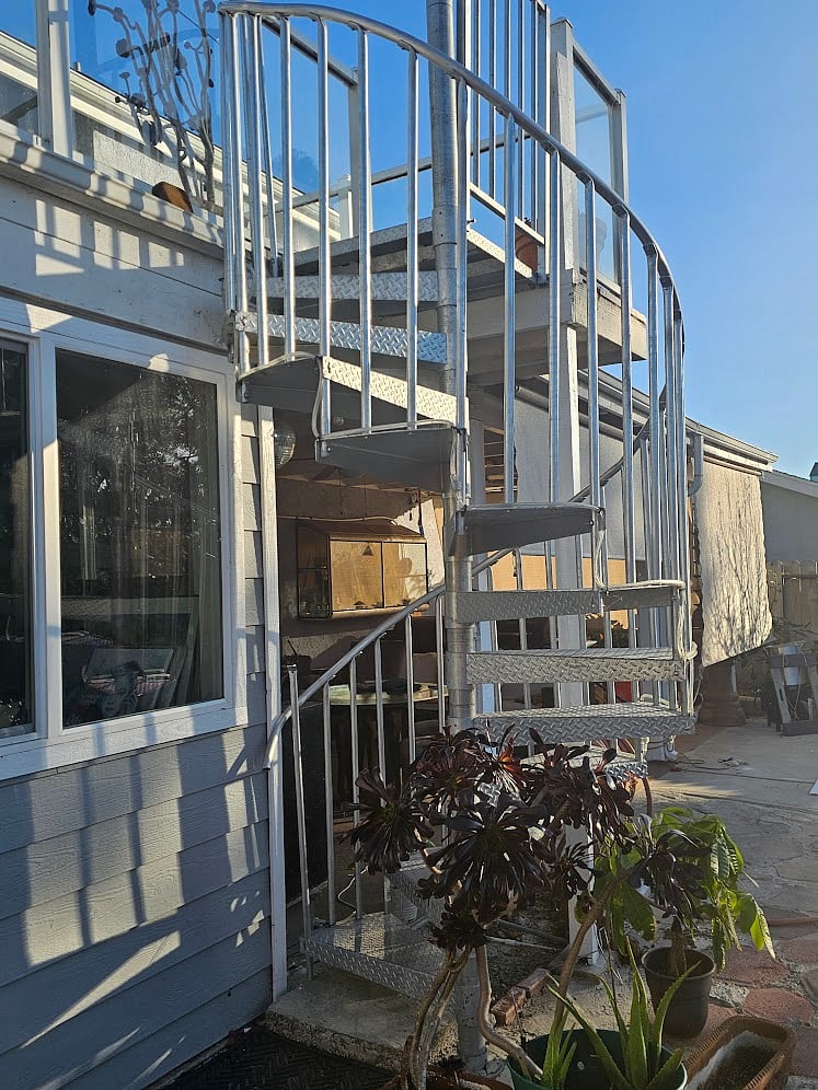 Spiral staircase. If you need to move large suitcases, we can bring through the house to the patio.  Sewing room next door has a slider.