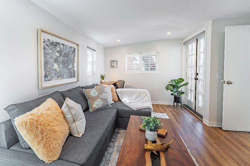 Past the kitchen is spacious family room/office/bedroom with french doors that lead to the back deck.
