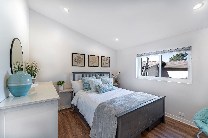 The primary bedroom, located off of the living room/dining room, is a relaxing oasis.