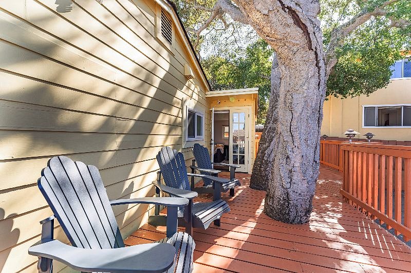 Relax and enjoy the shade from the trees on the back deck, accessed via the french doors in the family room/office/bedroom.