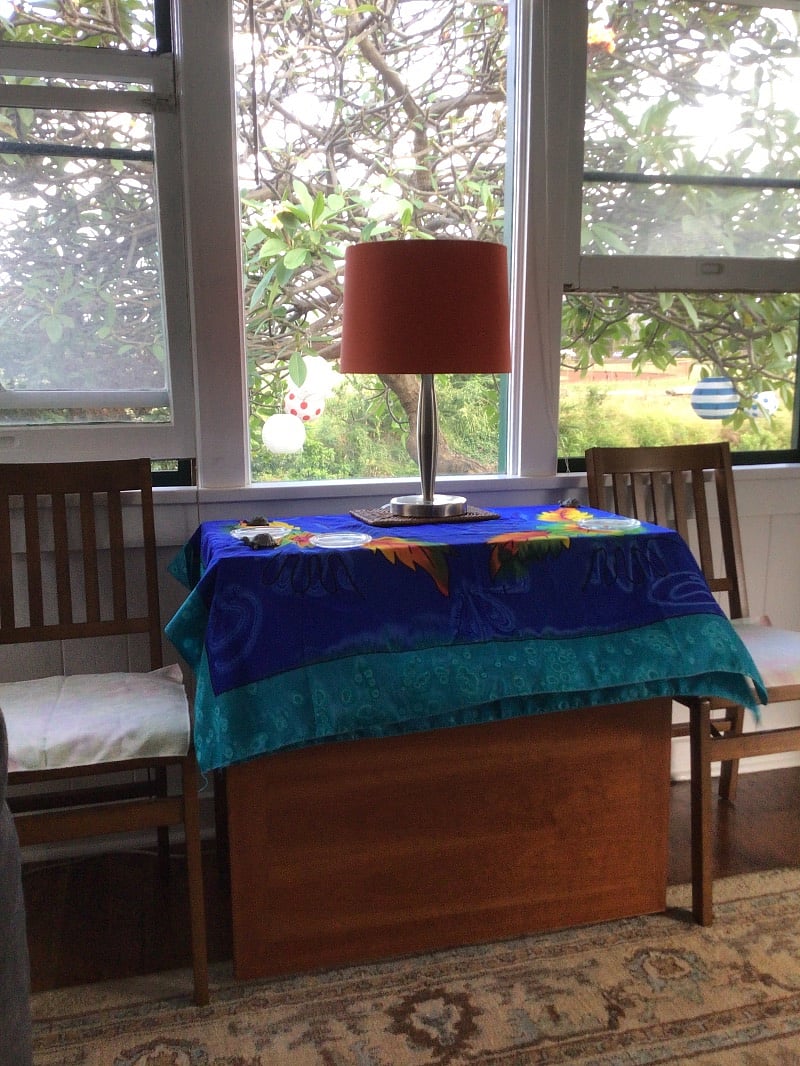 Living room looking out to yard, dining table.